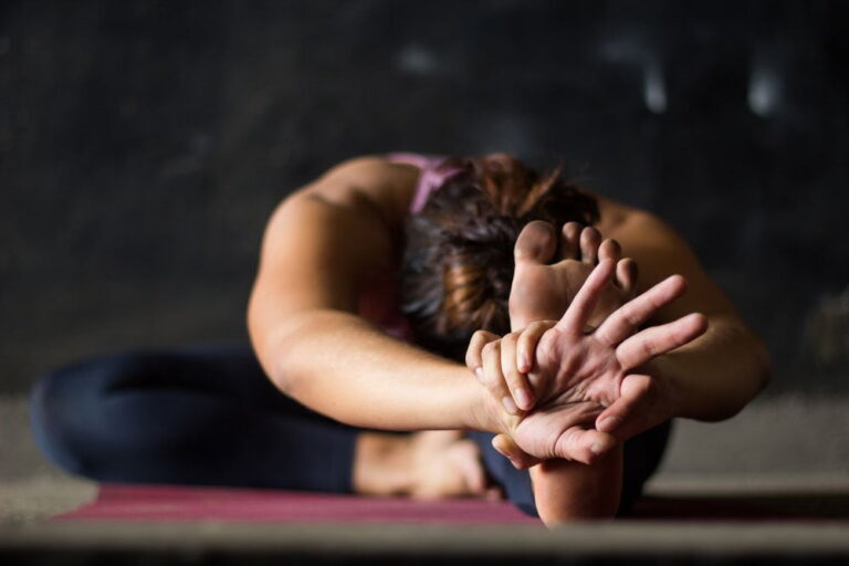 Seated forward stretch over crossed legs