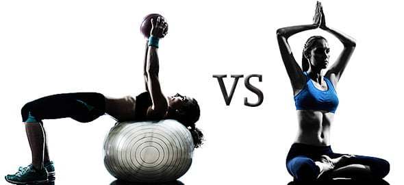 Exercise on a fitness ball beside a seated yoga pose