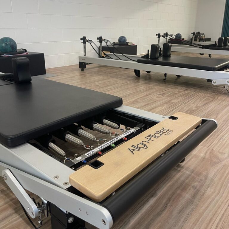 Reformer beds lined up in the Pilates Rockhampton studio