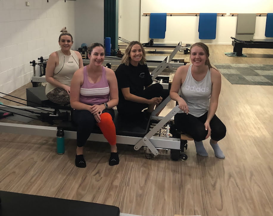 A total body fitness Pilates Reformer group class at Pilates Rockhampton studio, 176 Main St, Park Avenue.