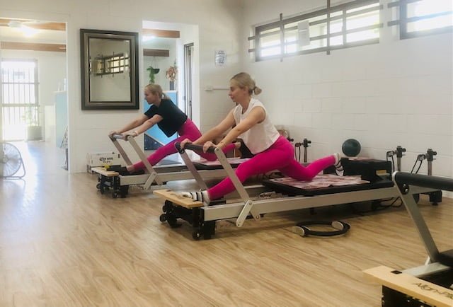 A total body fitness Pilates Reformer group class at Pilates Rockhampton studio, 176 Main St, Park Avenue.