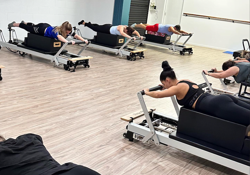A total body fitness Pilates Reformer group class at Pilates Rockhampton studio, 176 Main St, Park Avenue.